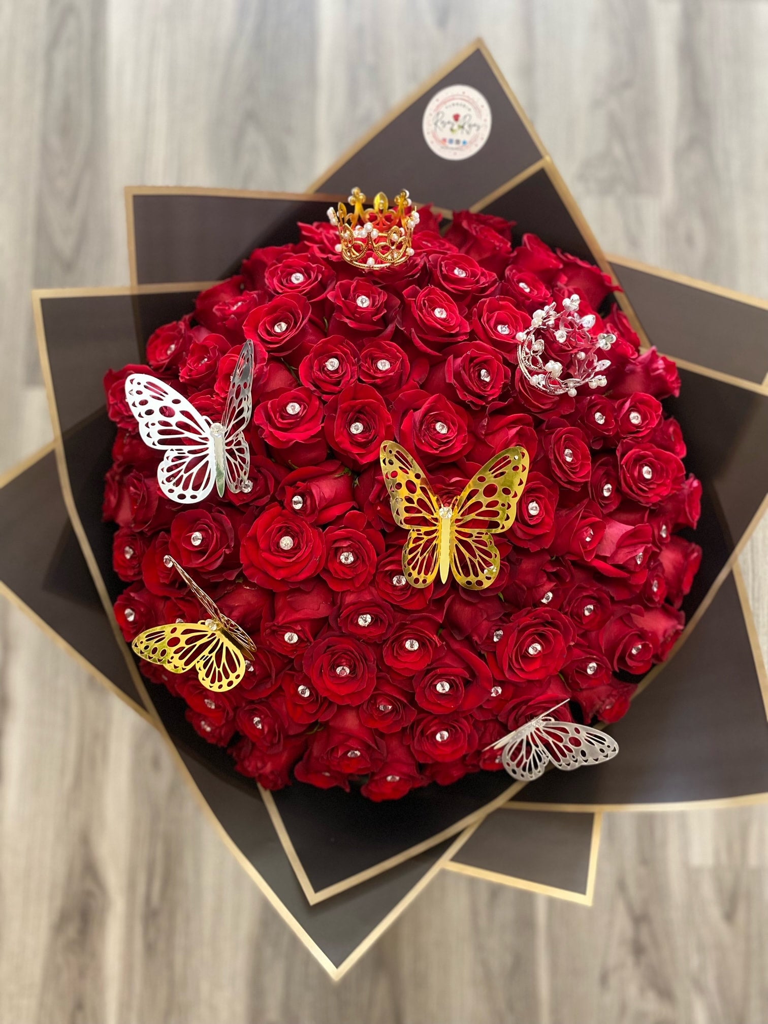 Beautiful Buchon of 75 Red Roses with crown and butterflies